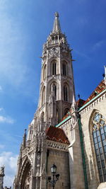 Low angle view of church against blue sky