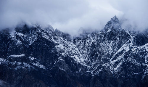 Scenic view of mountains against sky during winter