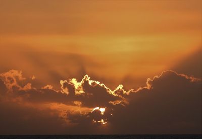 Low angle view of dramatic sky during sunset