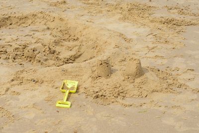 High angle view of toy on sand