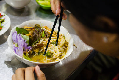 Cropped hand of person having food