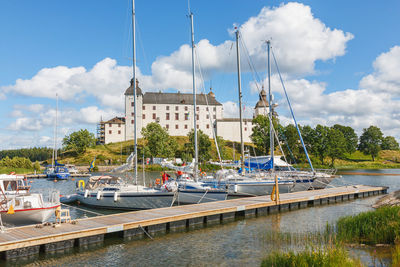 Lacko castle with sailboats at the jetty