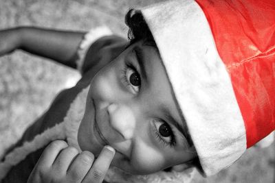 Close-up portrait of girl lying down