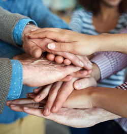 Low section of couple holding hands