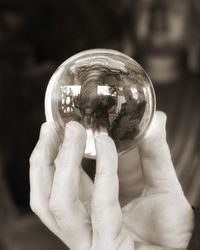 Close-up of hand holding ball