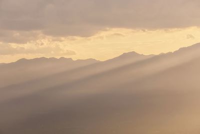 Scenic view of mountains against sky during sunset
