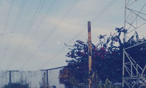 Low angle view of electricity pylon