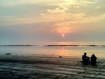 Scenic view of sea at sunset