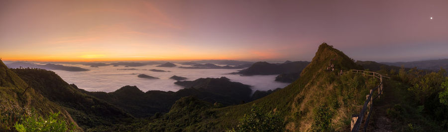 Scenic view of mountains against sky during sunset