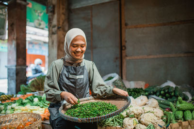 Portrait of young man preparing food