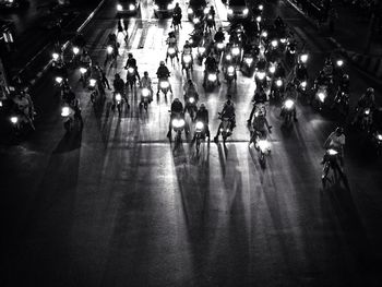 Blurred motion of people walking on road at night