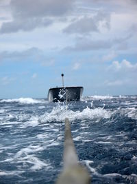 View of sailboat in sea against sky