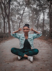 Portrait of mature girl sitting under the beautiful nature 