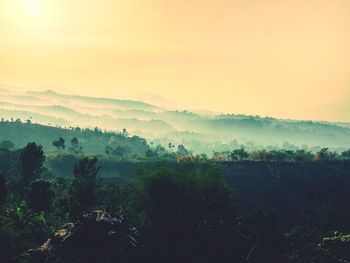 Scenic view of landscape against sky during sunset