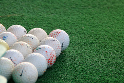 Close-up of multi colored ball on grassland