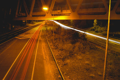 High angle view of light trails on road at night