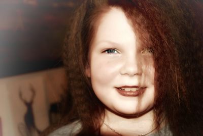 Close-up portrait of smiling young woman