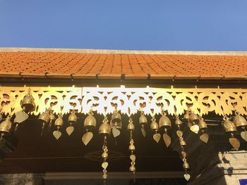 Low angle view of illuminated building against clear sky