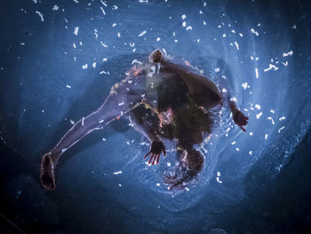 Group of people swimming in sea