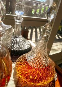 Close-up of glass bottles on table