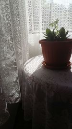 Close-up of curtain on table at home