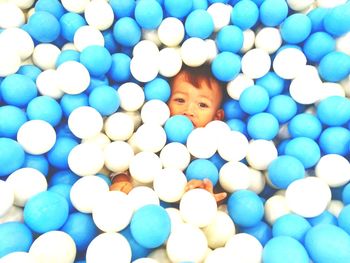 Portrait of boy with ball in blue balls