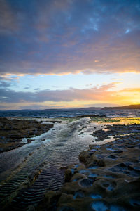 Scenic view of sea against sky during sunset
