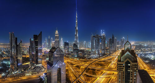 Panoramic view of illuminated buildings in city at night