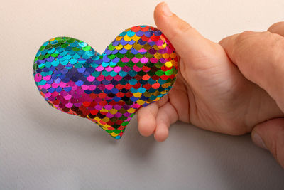 Close-up of hand holding heart shape