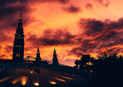 Built structure against cloudy sky at sunset