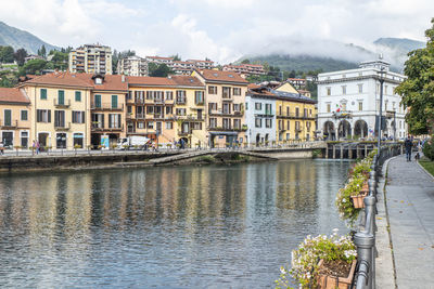  the beautiful omegna, with splendid buildings that are reflected on lake orta