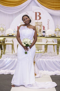 Portrait of bride holding bouquet