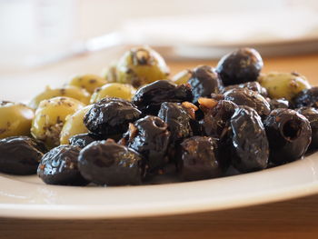 Close-up of pickled olives in plate