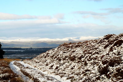 Scenic view of mountains against sky during winter
