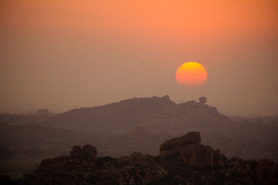 Scenic view of mountains at sunset