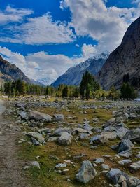 Scenic view of lake and mountains against sky