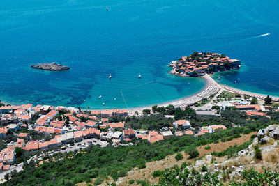 High angle view of townscape by sea