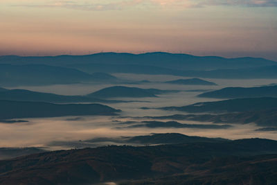 Scenic view of mountains against sky during sunset