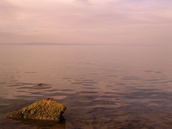 Scenic view of sea against sky at sunset