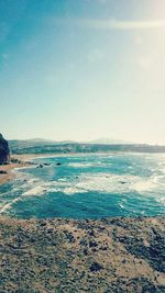 Scenic view of sea against blue sky