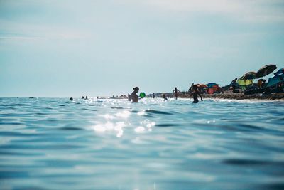 People swimming in sea