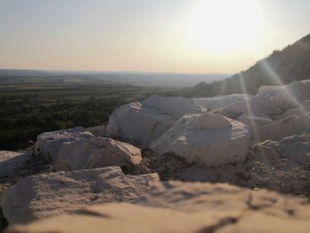 Scenic view of land against sky during sunset