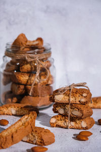 Traditional italian cantuccini cookies with almonds in glass jar. sweet dried biscuits. homemade 