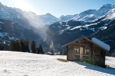 Scenic view of snow covered mountains against sky