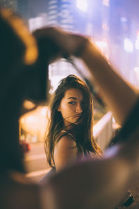 Young woman standing outdoors