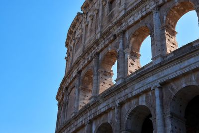 Low angle view of colosseum against clear sky