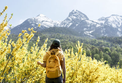 Rear view of man standing on mountain