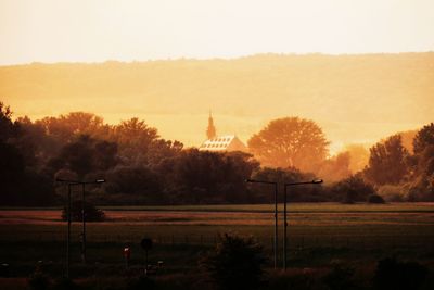 Silhouette of temple against sky during sunset