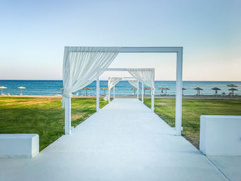 Lifeguard hut on beach against clear sky