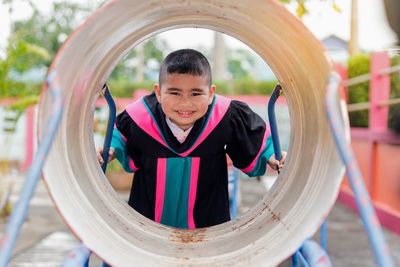 Portrait of smiling boy playing at playground